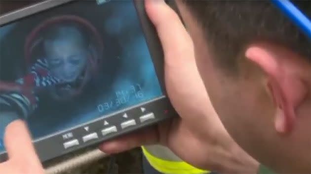 Emergency services were forced to inject oxygen into the hole and used a special device to pinpoint the boy's location - uncovering that he was, in fact, stuck more than 11 metres beneath the surface. Photo: CCTV News