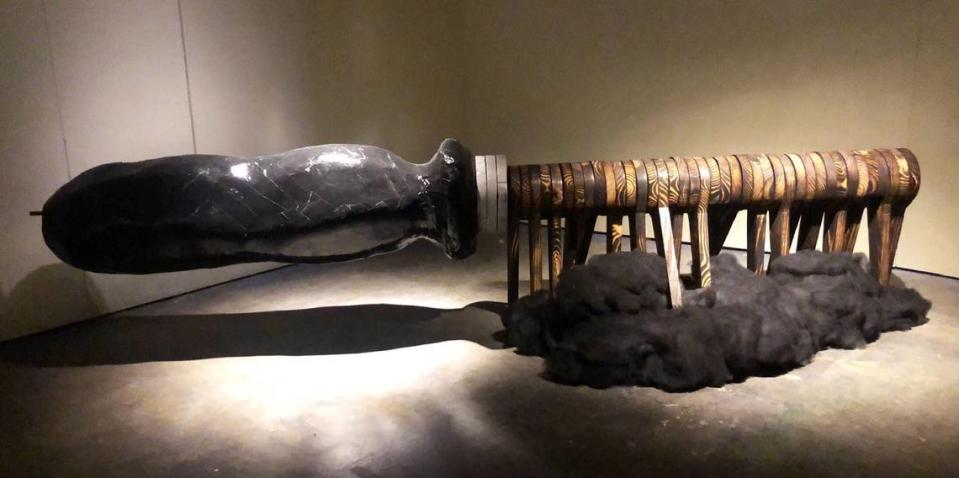 Nadia Meadows used burned wood to make a giant straightening comb in “Lines of Control.” She said it shows how the tool burns one’s scalp and damages one’s hair while dictating what style society has judged appropriate for “people with tightly coiled hair.”