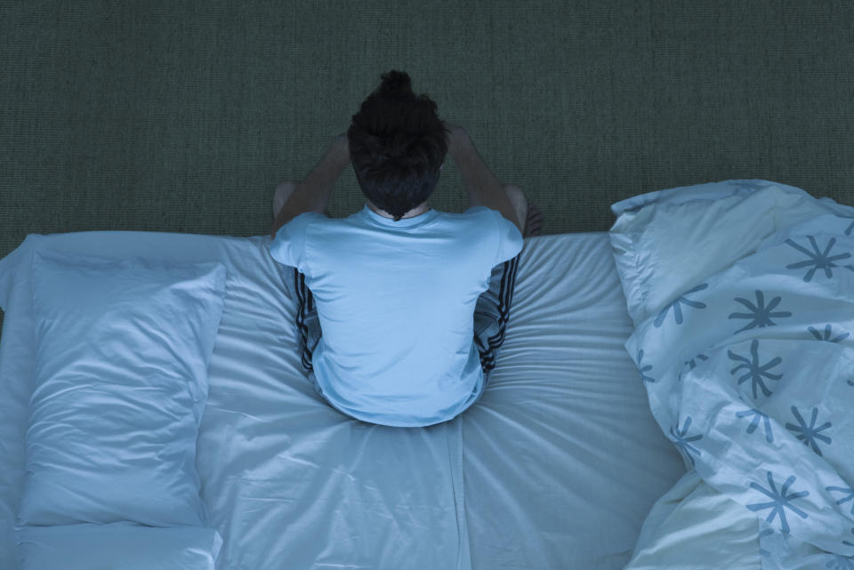 A person sitting up in bed