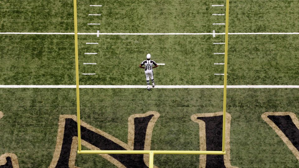 Carey stands on the field before a game in New Orleans in 2009. - Patrick Semansky/AP