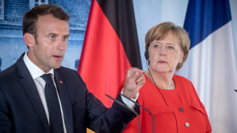 Bundeskanzlerin Angela Merkel und Emmanuel Macron, Präsident von Frankreich, bei einer Pressekonferenz auf Schloss Meseberg. Foto: Michael Kappeler