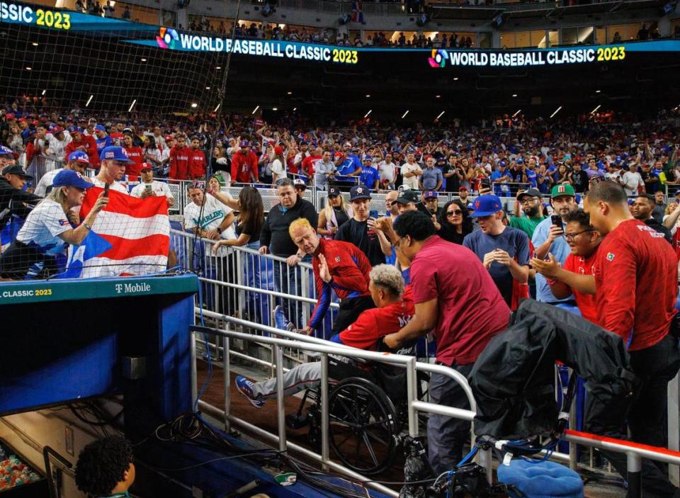 Puerto Rico pitcher Edwin Diaz (39) take him in a wheelchair after the the Pool D game against Dominican Republic at the World Baseball Classic at loanDepot Park on Wednesday, March 15, 2023, in Miami, Fla.