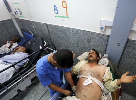 A medic attends to a patient at a government hospital in Sanaa, Yemen, June 24, 2015. REUTERS/Khaled Abdullah