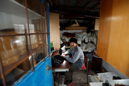 Mehdi Omar, a 62-year-old Uighur shoemaker, works at his workshop in Kayseri, Turkey, January 31, 2019. REUTERS/Murad Sezer