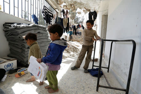 Children are seen at a shelter in Adra near Damascus, Syria, March 20, 2018. REUTERS/Omar Sanadiki