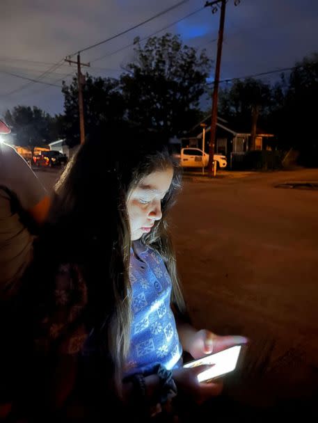 PHOTO: Gemma, a 5th grader who attended Robb Elementary School, waits for the bus on her first day back to school, Sept. 6. (Olivia Osteen/ABC News)