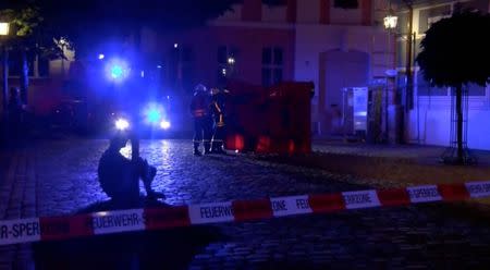 Emergency workers are seen following an explosion in Ansbach, near Nuremberg July 25, 2016, in this still image taken from video. Courtesy News5/via Reuters TV