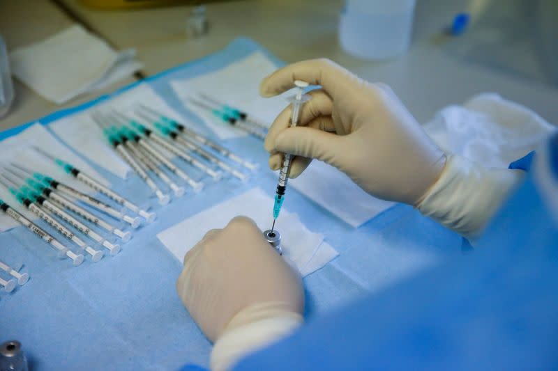 A medical worker prepares the Pfizer-BioNTech COVID-19 vaccine at Sao Jose Hospital in Lisbon