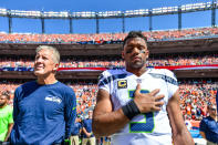 <p>Head coach Pete Carroll and quarterback Russell Wilson #3 of the Seattle Seahawks stand during the national anthem before a game against the Denver Broncos at Broncos Stadium at Mile High on September 9, 2018 in Denver, Colorado. (Photo by Dustin Bradford/Getty Images) </p>