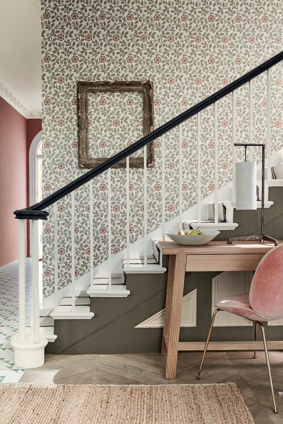 white balustrade and floral wallpaper on staircase by Little Greene