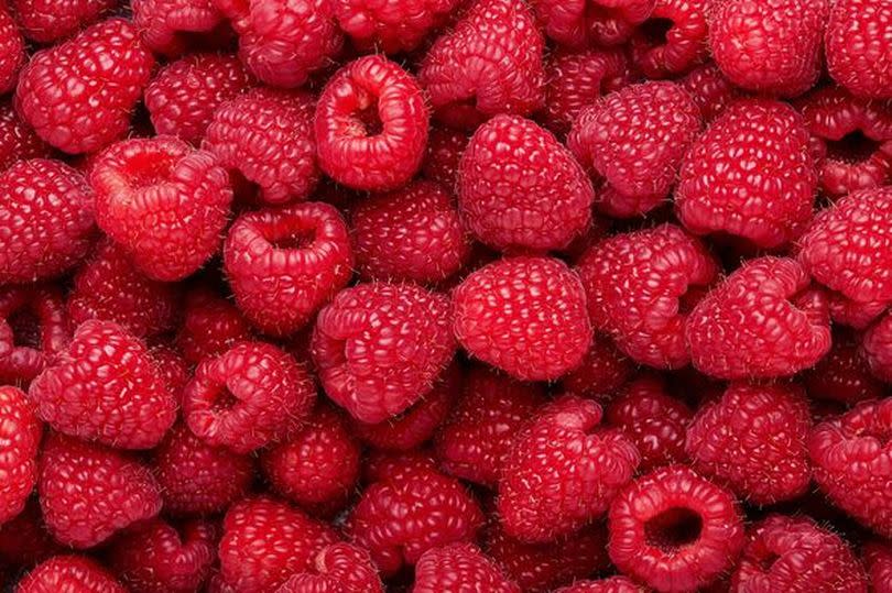 Fresh and sweet raspberries background