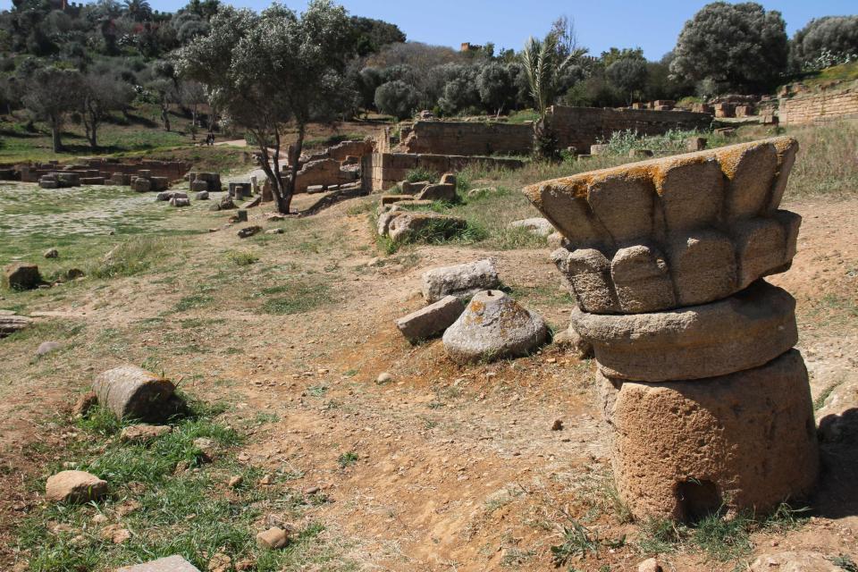 In this March 10, 2012 photo, a carved fragment of a pillar rests on the grassy forum of the old Roman city of Sala Colonia near the Moroccan capital Rabat. (AP Photo/Paul Schemm)