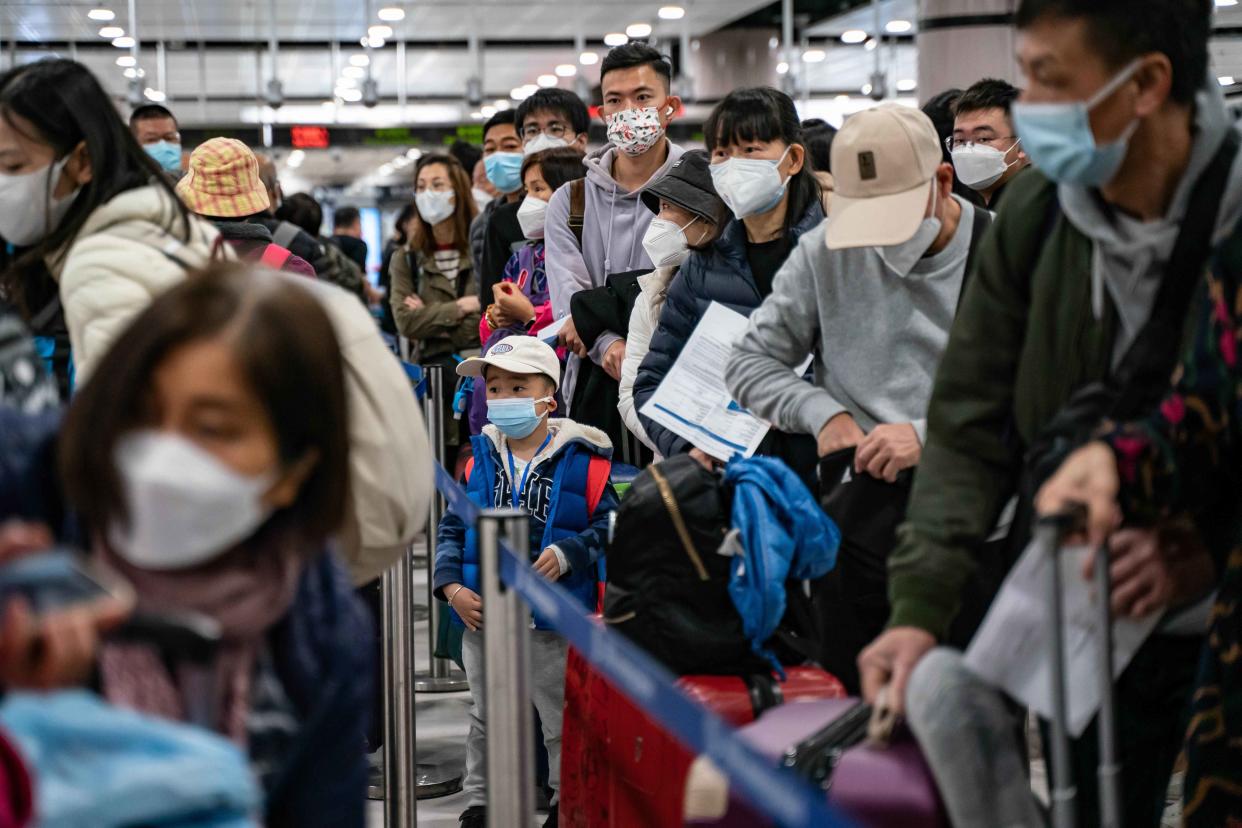 Tens of thousands cross Hong Kong-mainland China border as Covid zero ends after 3 years of restrictions.  (Anthony Kwan / Getty Images)
