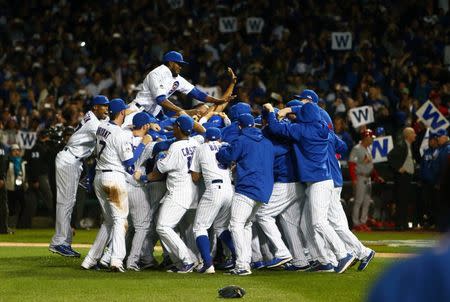 October 13, 2015; Chicago, IL, USA; Chicago Cubs celebrate after the 6-4 victory against St. Louis Cardinals to win the NLDS at Wrigley Field. Mandatory Credit: Jerry Lai-USA TODAY Sports