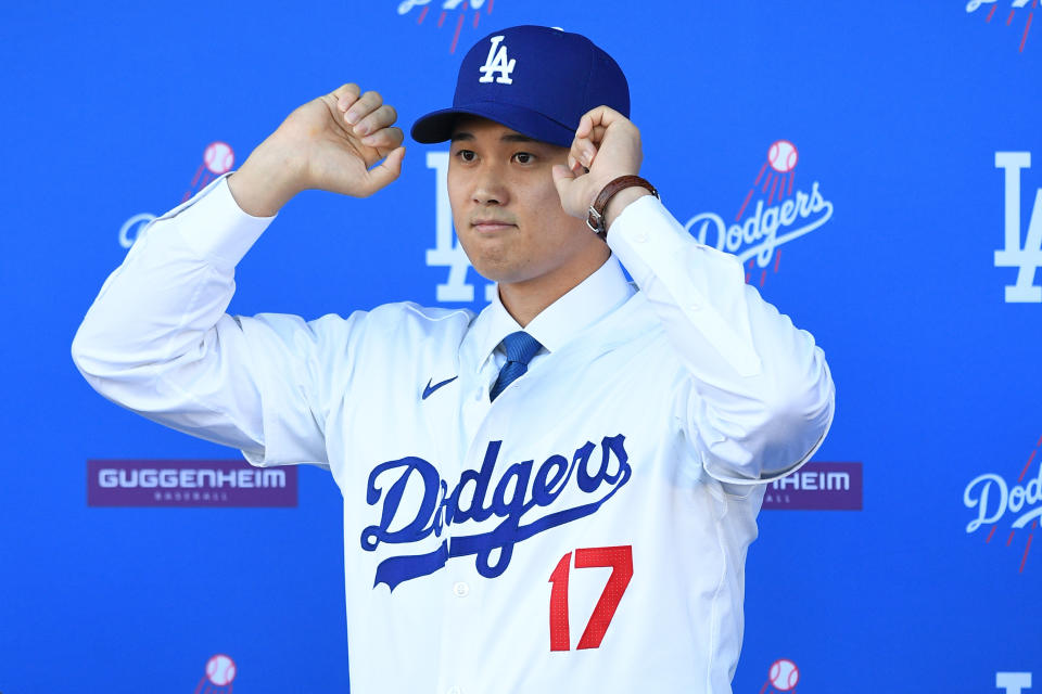 LOS ANGELES, CA - DECEMBER 14: Newly acquired Los Angeles Dodgers designated hitter Shohei Ohtani looks on as he is introduced at a press conference on December 14, 2023 at Dodger Stadium in Los Angeles, CA. (Photo by Brian Rothmuller/Icon Sportswire via Getty Images)