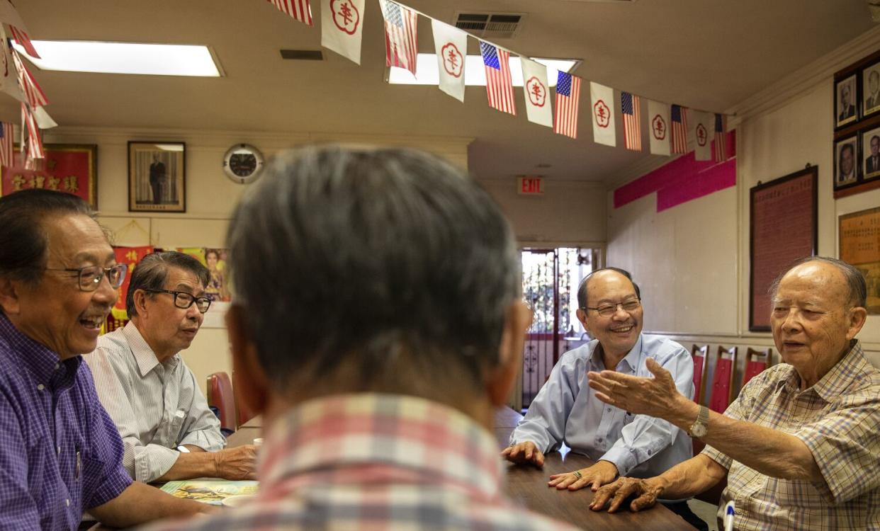 From left, Ernest Lee, Chuck Lee, Stephen Lee, Derek Ma and Allen Lee gather in Chinatown