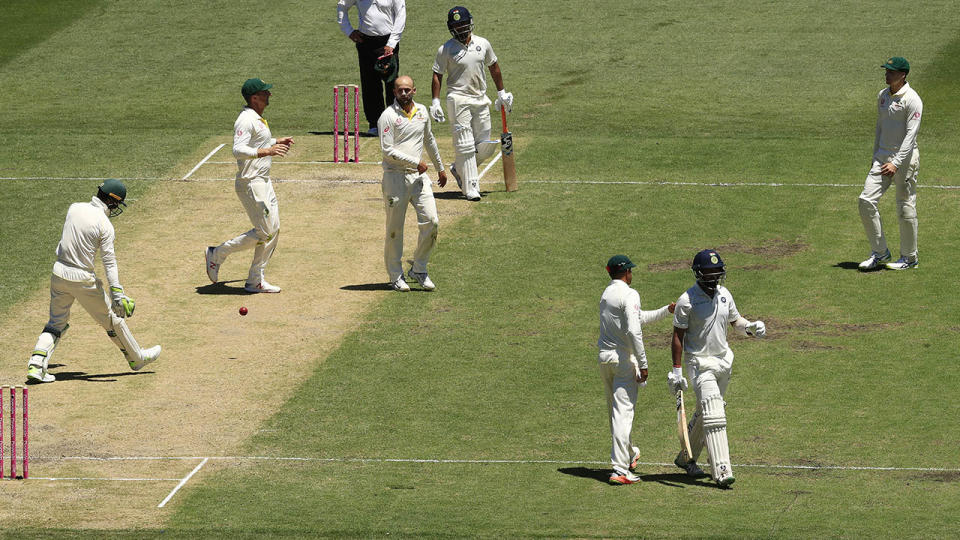 Nathan Lyon celebrates the wicket of Cheteshwar Pujara. (Photo by Mark Evans/Getty Images)
