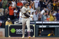 San Diego Padres designated hitter Fernando Tatis Jr. flips his bat as he watches his three-run home run against the Houston Astros during the ninth inning of a baseball game Saturday, May 29, 2021, in Houston. (AP Photo/Michael Wyke)