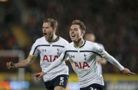 Tottenham Hotspur's Christian Eriksen (R) celebrates scoring a goal with team-mate Jan Vertonghen during their English Premier League soccer match against Hull City at the KC Stadium in Hull, northern England November 23, 2014. REUTERS/Andrew Yates