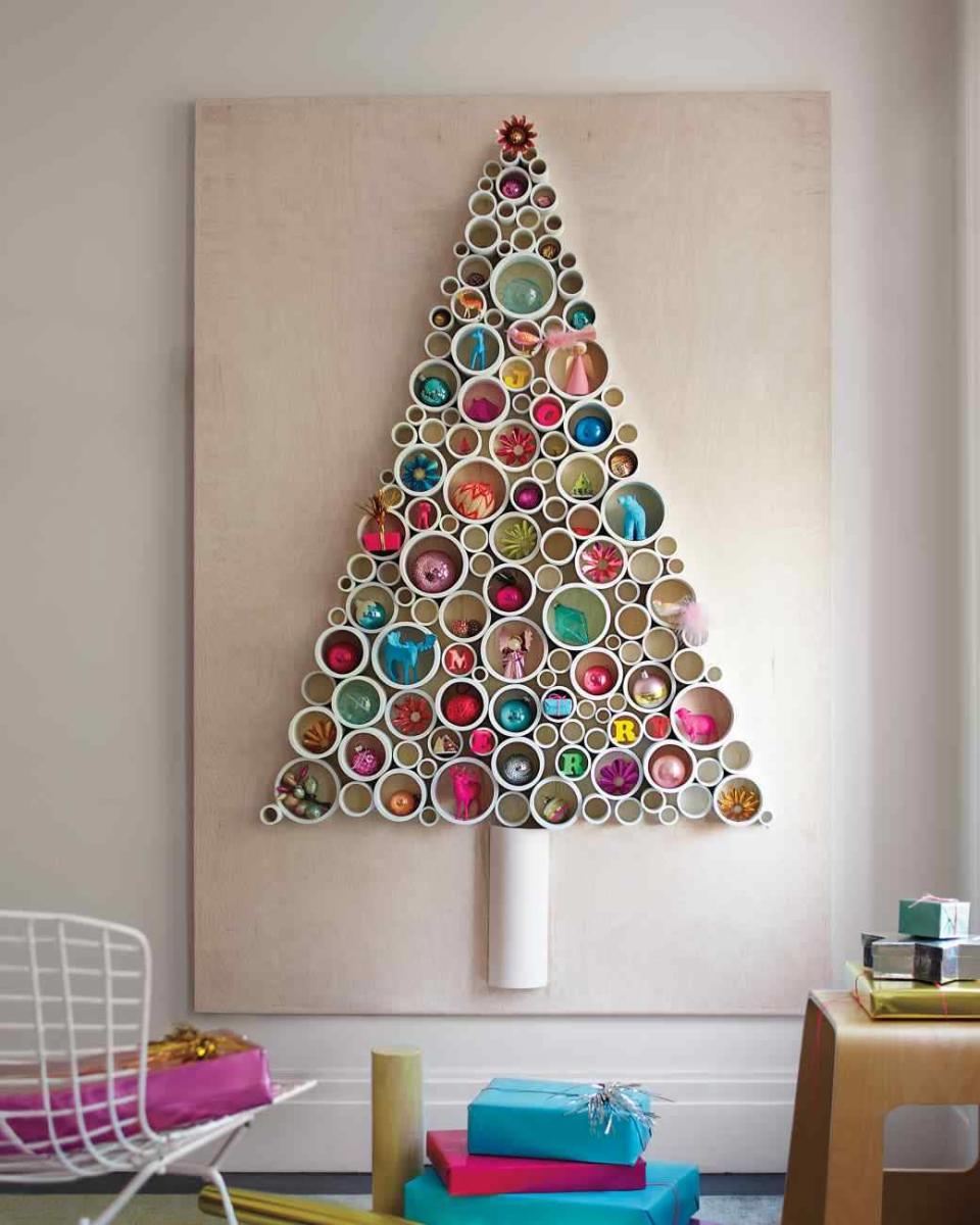 This idea is brilliant. Display the decorations inside tubes instead of on branches. [Photo: Pinterest]