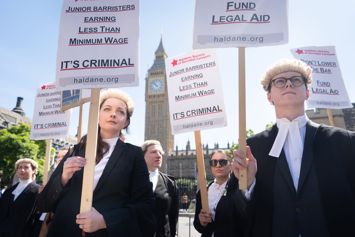 Criminal defence barristers outside the Houses of Parliament (Stefan Rousseau/PA) (PA Wire)