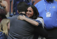 Meghan, Duchess of Sussex, greets Alexis Ohanian, as she arrives to watch the women's singles final of the U.S. Open tennis championships between Serena Williams, of the United States, and Bianca Andreescu, of Canada, Saturday, Sept. 7, 2019, in New York. (AP Photo/Charles Krupa)