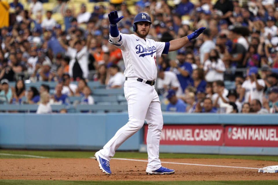 Los Angeles Dodgers' Max Muncy gestures after hitting a single during the first inning of the team's baseball game against the San Francisco Giants on Thursday, July 22, 2021, in Los Angeles. (AP Photo/Marcio Jose Sanchez)