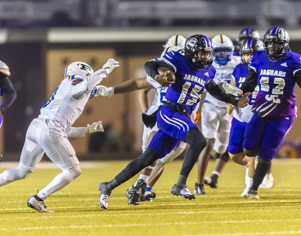 LBJ quarterback Ali Scott runs for extra yards through the Pflugerville defense during their Nov. 10, 2023 game at Nelson Field. Scott produced 40 total touchdowns last season.