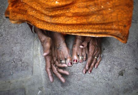 The mother of 30-year-old Phoolbai, who died after she underwent a sterilization surgery at a government mass sterilisation "camp", reacts at her home in Aamsena village in Bilaspur district, Chhattisgarh, November 13, 2014. REUTERS/Anindito Mukherjee