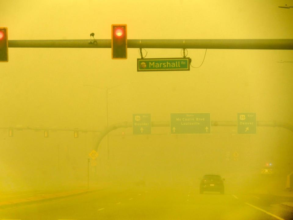 Clouds of yellow smoke on Marshall Road in Louisville, Colorado.