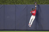 Miami Marlins center fielder Jazz Chisholm Jr. catches a ball hit by Washington Nationals' Lane Thomas during the first inning of a baseball game, Saturday, Aug. 26, 2023, in Miami. (AP Photo/Wilfredo Lee)