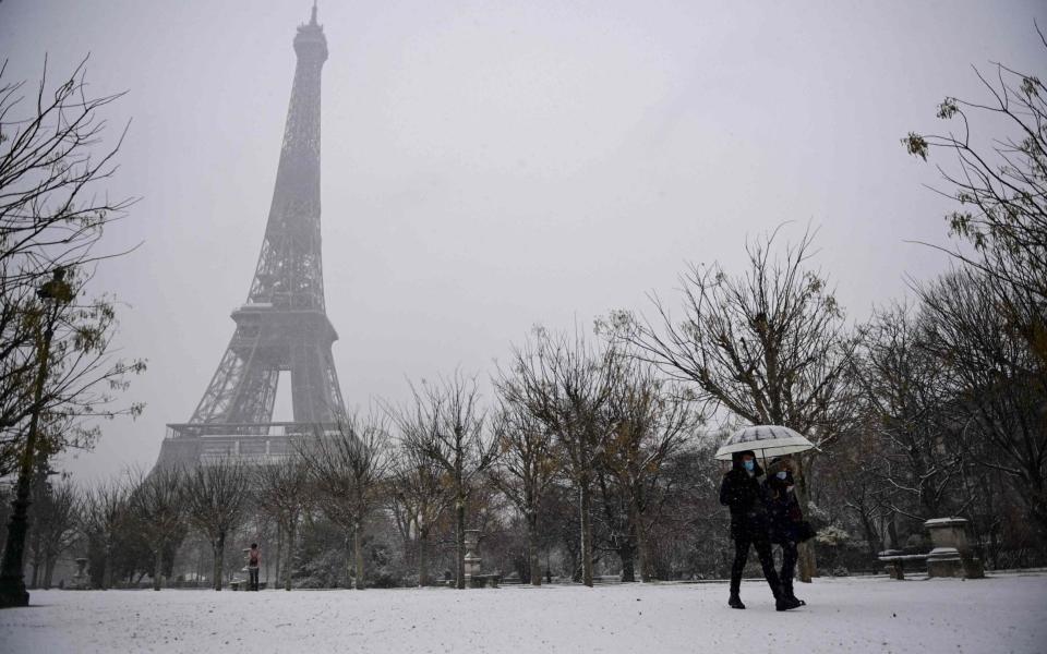 The cold weather has chilled Europe too, with snow blanketing Paris - GETTY IMAGES