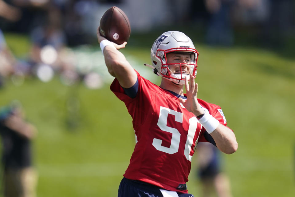 New England Patriots quarterback Mac Jones throws a pass during an NFL football practice, Friday, July 30, 2021, in Foxborough, Mass. (AP Photo/Elise Amendola)