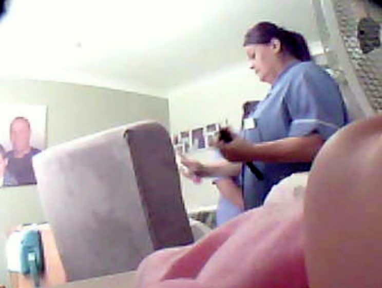 A carer has been caught on camera manhandling and abusing an elderly dementia patient