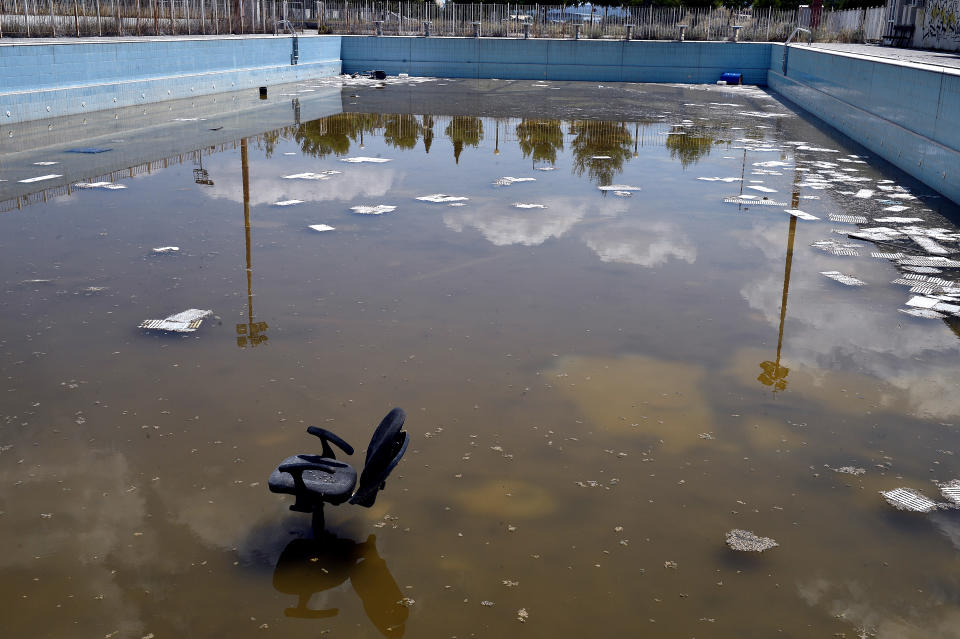 ATHENS, GREECE - JULY 31: General view of a swimming pool in the former Olympic Village in Athens, Greece on July 31, 2014. Ten years ago the XXVIII Olympiad was held in Athens from the 13th - 29th August with the motto 