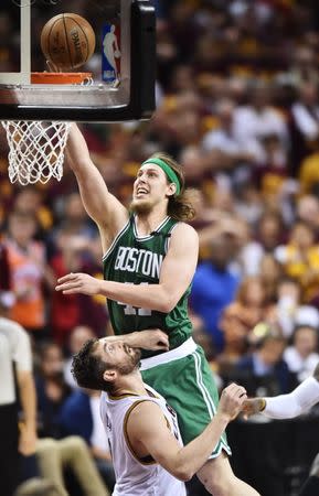 May 21, 2017; Cleveland, OH, USA; Boston Celtics center Kelly Olynyk (41) drives to the basket against Cleveland Cavaliers forward Kevin Love (0) during the second half in game three of the Eastern conference finals of the NBA Playoffs at Quicken Loans Arena. Mandatory Credit: Ken Blaze-USA TODAY Sports