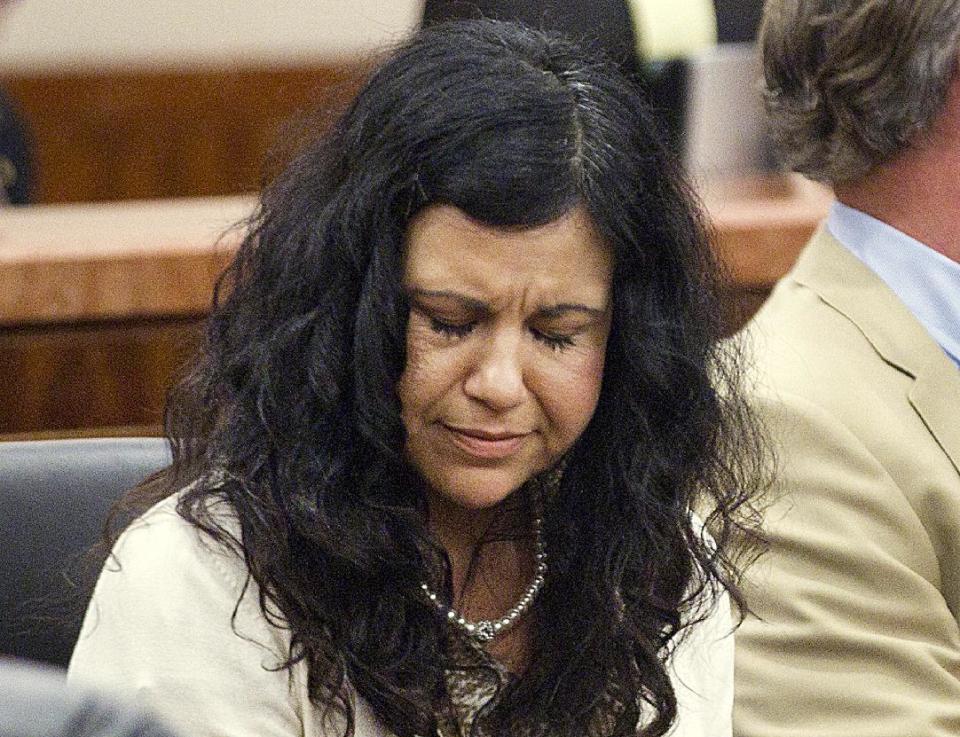 FILE - In this April 8, 2014, file photo, Ana Trujillo reacts after being found guilty of killing her boyfriend in Houston. Trujillo, 45, was found guilty of fatally stabbing her boyfriend with the stiletto heel of her shoe, hitting him at least 25 times in the face. Jurors have begun deliberating her sentence. (AP Photo/Houston Chronicle, Brett Coomer, File)