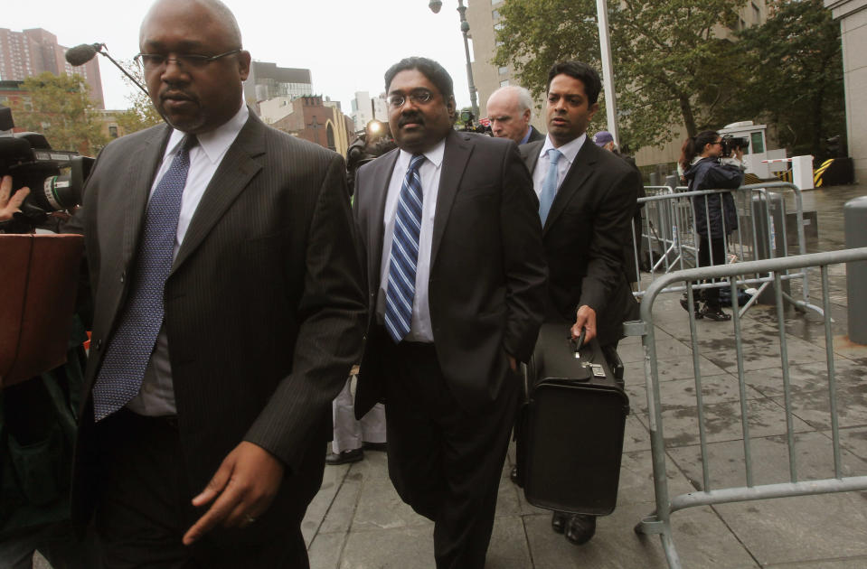 <b>Raj Rajaratnam</b><br><br>Raj Rajaratnam is currently serving prison time at the <a href="http://dealbook.nytimes.com/2011/11/03/raj-rajartnam-assigned-to-massachusetts-prison/" rel="nofollow noopener" target="_blank" data-ylk="slk:Federal Medical Center Devens in Ayer, Mass;elm:context_link;itc:0;sec:content-canvas" class="link ">Federal Medical Center Devens in Ayer, Mass</a>. The former hedge fund manager and founder of the Galleon Group, a New York hedge fund, was convicted of securities fraud and conspiracy in May 2011. He was sentenced to 11 years in prison, the longest for an insider-trading case. <br><br>Photo: Galleon Group founder Raj Rajaratnam, center, exits Manhattan Federal Court after a sentencing hearing on October 13, 2011 in New York City.