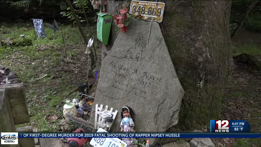 A memorial for Skylar with a stone marker and gifts