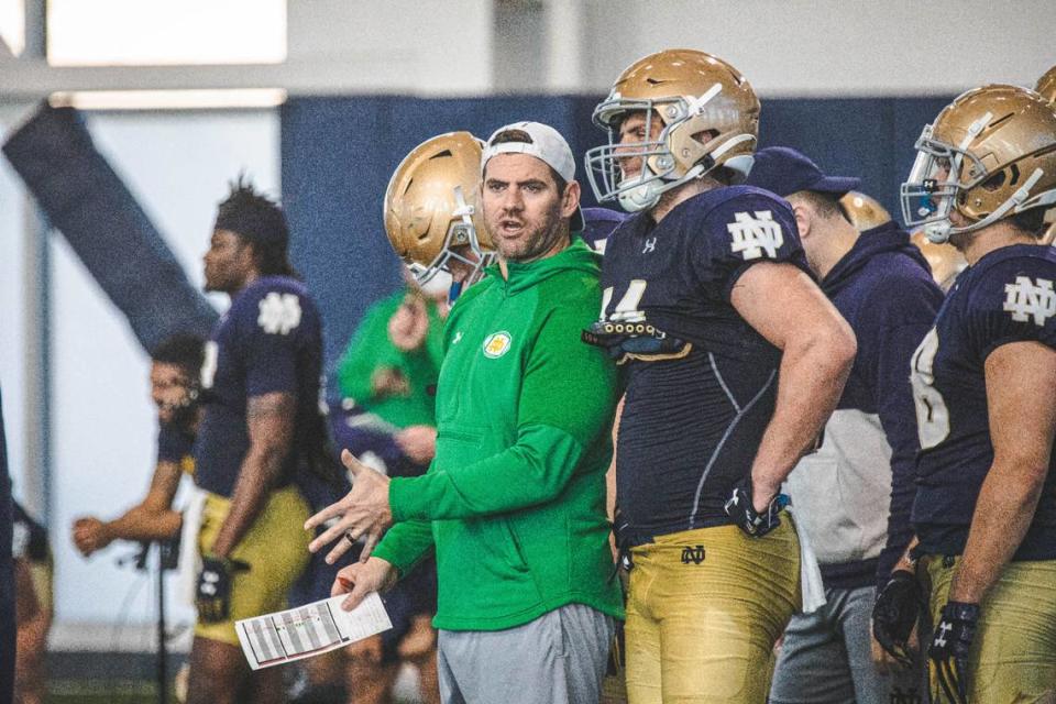 Former Lawrence County High School football star and University of Kentucky wide receiver Gerad Parker, center, is in his first season as Notre Dame offensive coordinator in 2023.