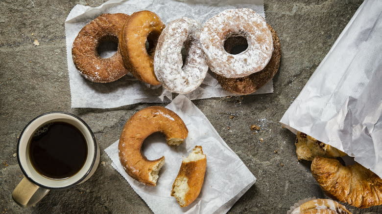 assorted donuts coffee concrete background