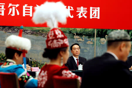 FILE PHOTO: Xinjiang Uighur Autonomous Region (XUAR) Party Secretary Chen Quanguo attends a group discussion session on the second day of the 19th National Congress of the Communist Party of China at the Great Hall of the People in Beijing, China October 19, 2017. To match Exclusive CHINA-XINJIANG/ REUTERS/Tyrone Siu/File Photo