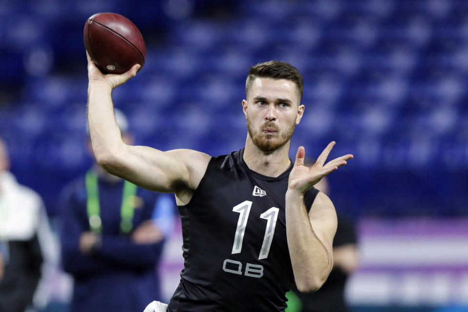 FILE - In this Feb. 27, 2020, file photo, Oregon State quarterback Jake Luton throws a pass at the NFL football scouting combine in Indianapolis. The Jacksonville Jaguars are going with another college journeyman and sixth-round draft pick as their backup quarterback. General manager Dave Caldwell and coach Doug Marrone kept rookie Jake Luton to play behind Gardner Minshew as they finalized their 53-man roster Saturday, Sept. 5, 2020. They cut veteran Mike Glennon and waived Josh Dobbs. (AP Photo/Michael Conroy, File)