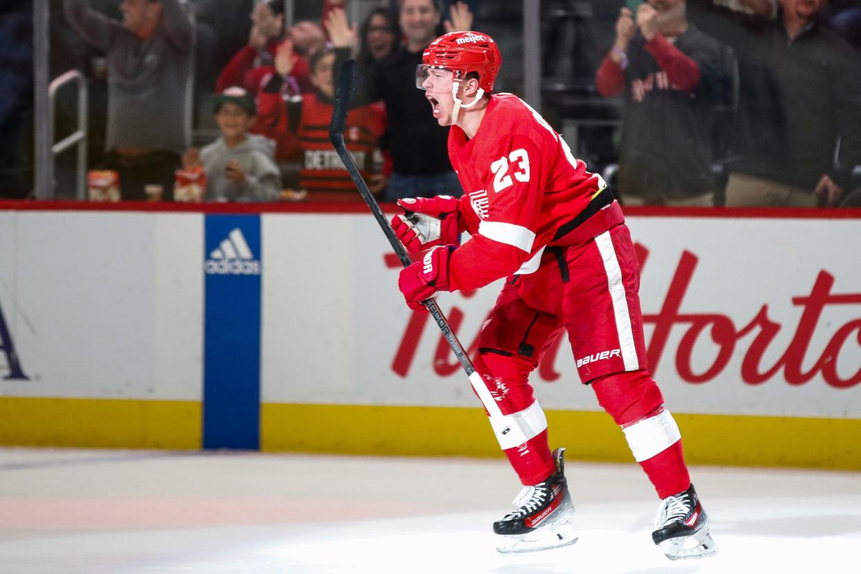 Detroit Red Wings left wing Lucas Raymond (23) celebrates scoring a goal against Montreal Canadiensduring the third period at Little Caesars Arena in Detroit on Monday, April 15, 2024.