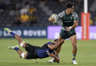 Australia's Jordan Petaia, right, is caught by Argentina's Rodrigo Bruni during their Tri-Nations rugby union match in Sydney, Australia, Saturday, Dec. 5, 2020. (AP Photo/Rick Rycroft)