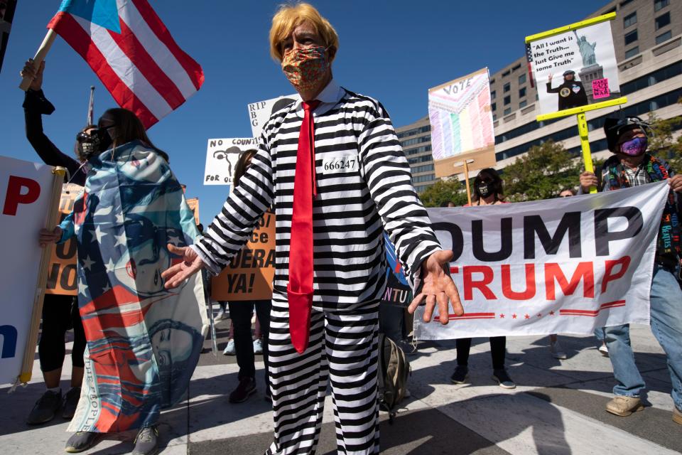 Protestors rally during the Women's March at Freedom Plaza, Saturday, Oct. 17, 2020, in Washington. (AP Photo/Jose Luis Magana)