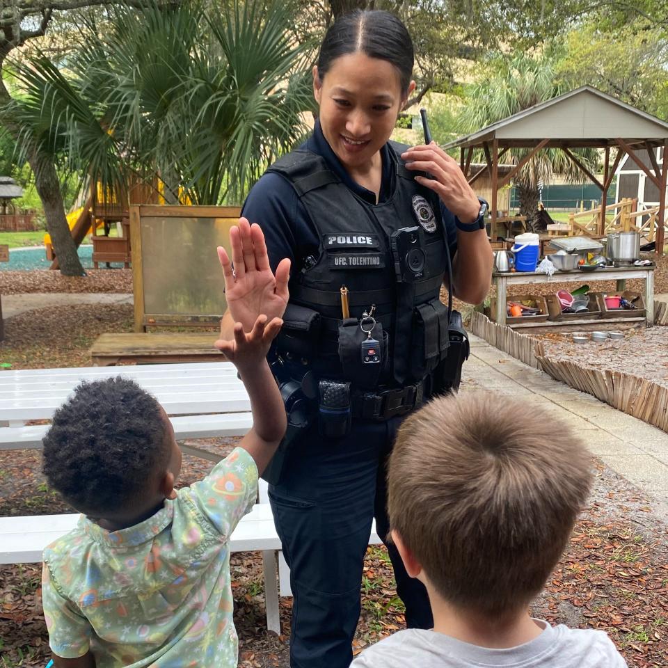 UCF police officers surprised children at the UCF Creative School with an egg hunt.