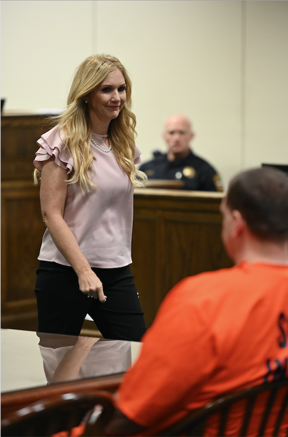 Melissa Brackman, widow of Todd Kohlhepp victim Scott Ponder, walks past the serial killer in court Friday, July 26, 2019, during a damages hearing.