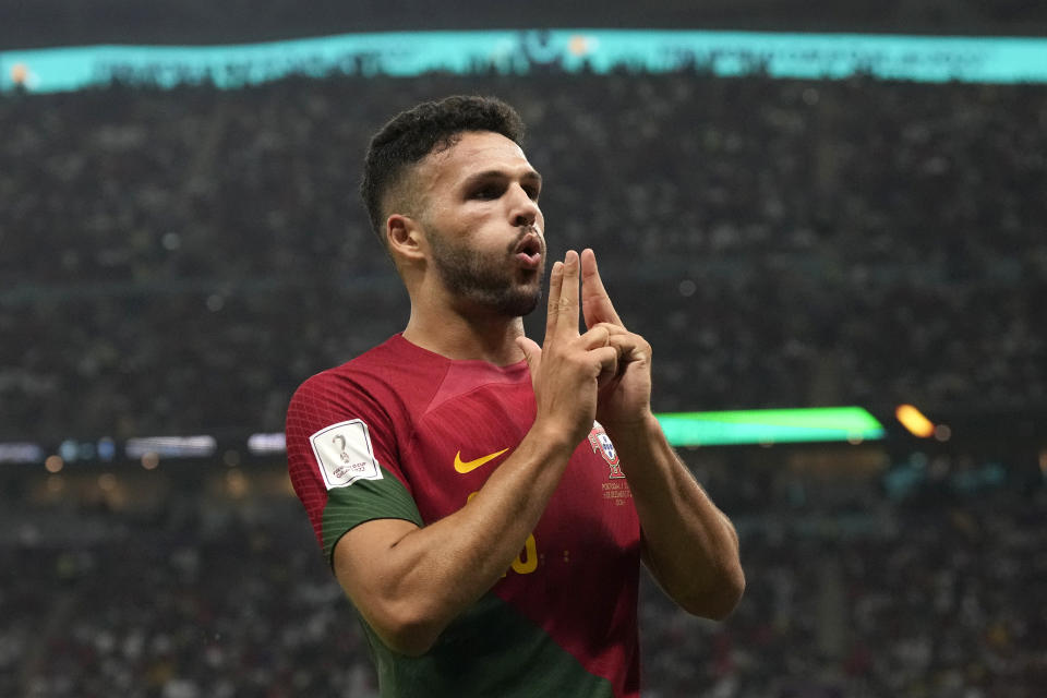 Portugal's Goncalo Ramos celebrates after scoring his side's fifth goal during the World Cup round of 16 soccer match between Portugal and Switzerland, at the Lusail Stadium in Lusail, Qatar, Tuesday, Dec. 6, 2022. (AP Photo/Alessandra Tarantino)