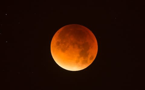 The Moon can turn yellow, orange, red of even black during an eclipse - Credit:  Eddie Mulholland